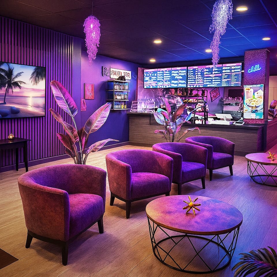 A vibrant purple-lit lounge area with comfortable chairs, coffee tables, and a counter with menus.